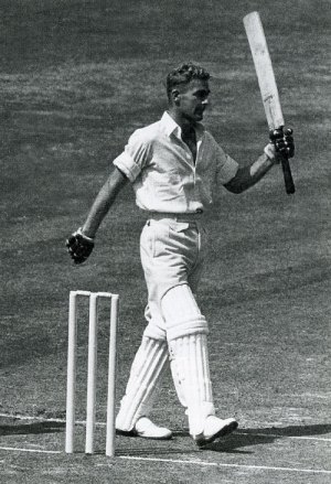 Donnelly raises a bat after his hundred at Lord's